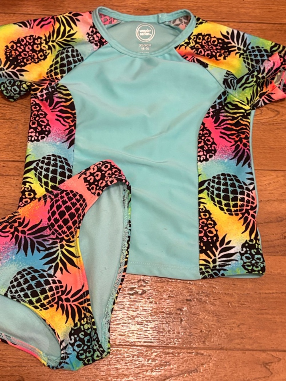 wonder nation Teal Rash Guard Set with Neon Rainbow Pineapple Print